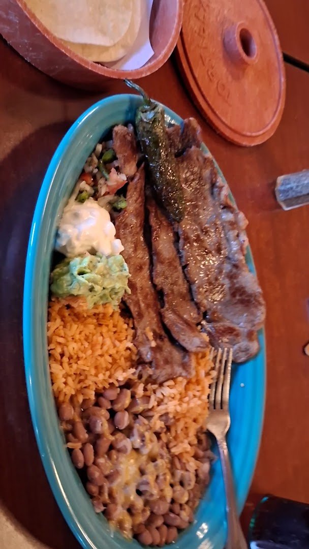 Colorful Mexican dishes on a restaurant table.
